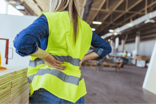 A female construction worker observing a job site