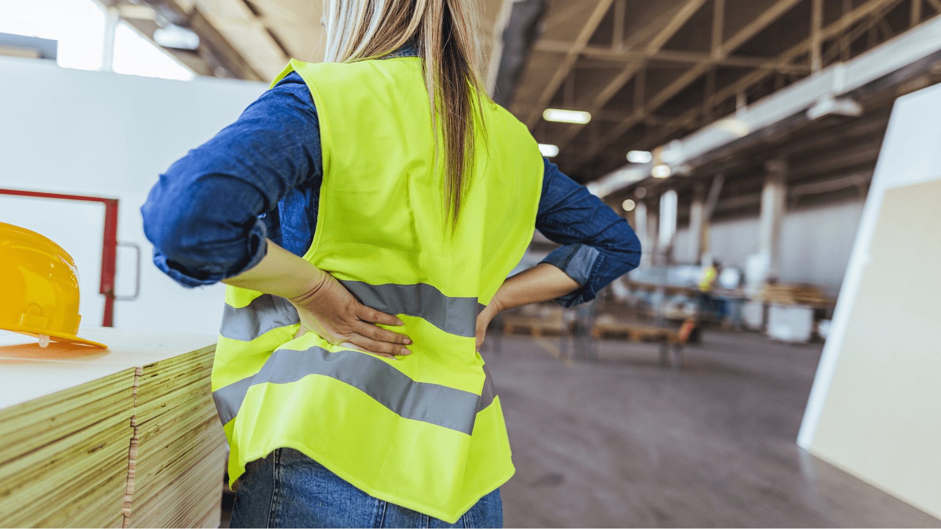 A female construction worker observing a job site