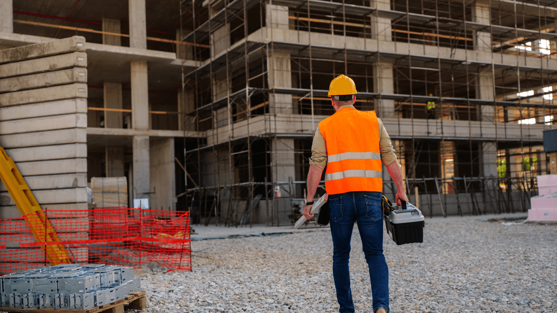 A construction worker approaching a job site