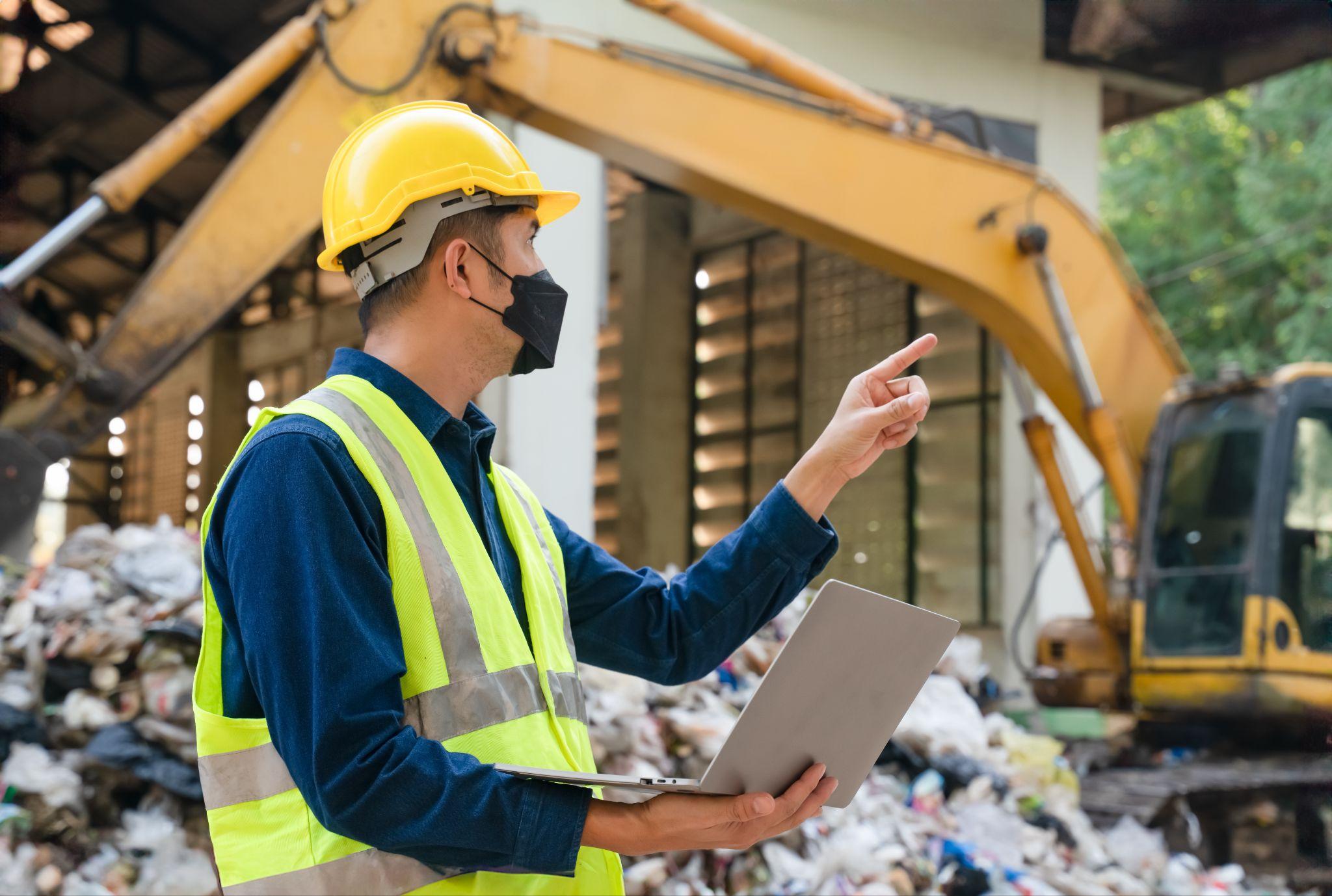 Site supervisor coordinating debris removal at a commercial property